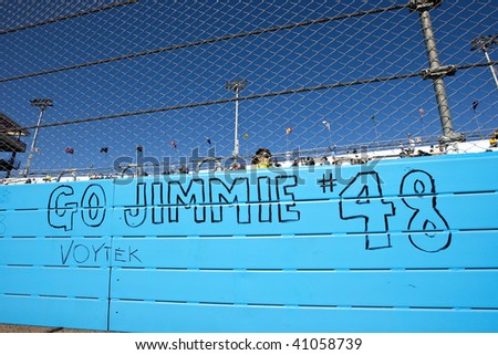 AVONDALE, AZ - NOV 15: Fans write on the track wall before the Checker O'Reilly Auto Parts 500 race at the Phoenix International Raceway on November 15, 2009 in Avondale, AZ.