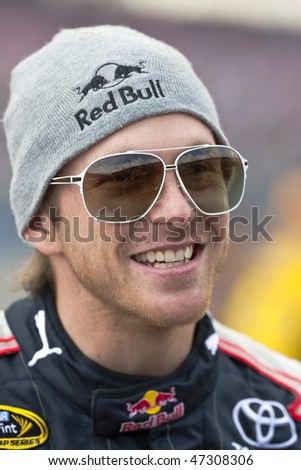 Fontana, CA - FEB 21, 2010:  Red Bull driver, Scott Speed, shares a laugh before the Auto Club 500 race a the Auto Club Speedway in Fontana, CA on Feb 21, 2010