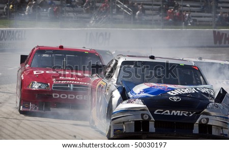 MARTINSVILLE, VA - MAR 29:  Scott Speed crashes off the turn for the running of the Goody\'s Fast Pain Relief 500 race at the Martinsville Speedway on Mar 29, 2010 in Martinsville, VA.