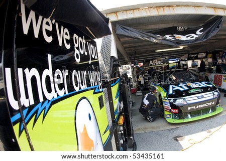 DOVER, DE - May 14:  Crew members prepare the Aflac Ford for practice at Dover International Speedway for the Autism Speaks 400 by Hershey\'s Milk & Milkshakes on May 14, 2010 in Dover, DE