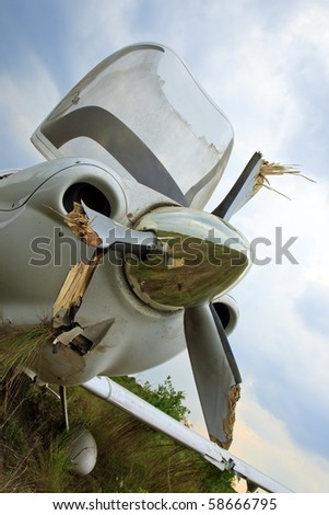 Small general aviation aircraft crash lands in a field