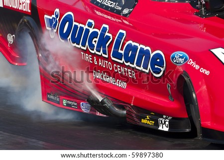 CONCORD, NC - MAR 27:  Robert Tasca III brings his Quicklane Ford Mustang down the track at the zMax Dragway for the running of the inaugural Four-Wide Nationals event in Concord, NC on Mar 27, 2010
