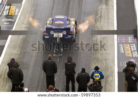 CONCORD, NC - MAR 28:  Ron Capps brings his NAPA Funny Car down the track at the zMax Dragway for the running of the inaugural Four-Wide Nationals event in Concord, NC on Mar 28, 2010
