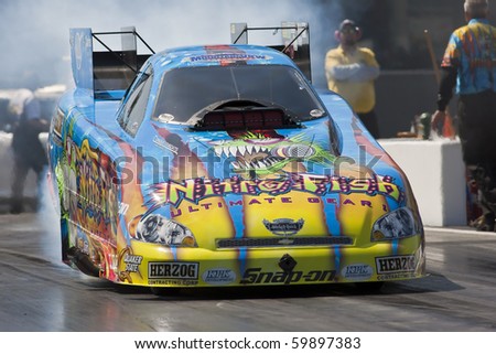 CONCORD, NC - MAR 27:  Tony Pedregon brings his Chevy Impala Funny Car down the track at the zMax Dragway for the running of the inaugural Four-Wide Nationals event in Concord, NC on Mar 27, 2010