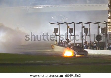 HAMPTON, GA - SEP 05:  Scott Speed pulls his Toyota down pit road after his engine catches on fire at the Emory Healthcare 500 race at the Atlanta Motor Speedway in Hampton, GA on Sep 05, 2010.