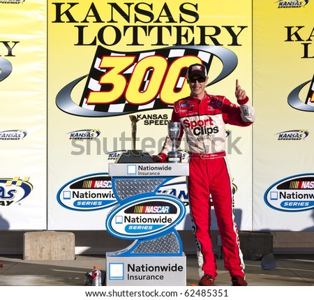 KANSAS CITY, KS - OCT 02:  Joey Logano holds off a hard charging field to win the Kansas Lottery 300 race on October 2, 2010 at the Kansas Speedway in Kansas City, KS.