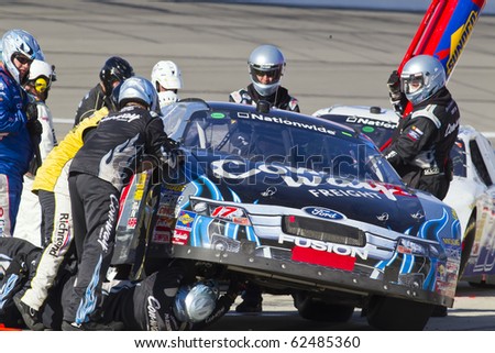 KANSAS CITY, KS - OCT 02:  Trevor Bayne brings in his Con-way Freight Ford Fusion in for service on October 2, 2010 during the Kansas Lottery 300 race at the Kansas Speedway in Kansas City, KS.