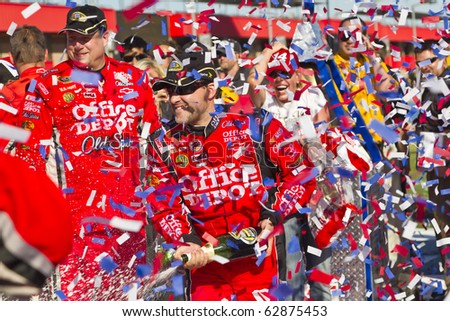 FONTANA, CA - OCT 10:  Tony Stewart holds off the rest of the Sprint Cup teams to win the Pepsi Max 400 race at the Auto Club Speedway in Fontana, CA on Oct 10, 2010.