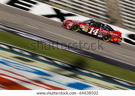 FORT WORTH, TX - NOV 06:  Tony Stewart (14) brings his race car through the frontstretch during practice for the AAA Texas 500 race on NOV 6, 2010 at the Texas Motor Speedway in Fort Worth, TX.