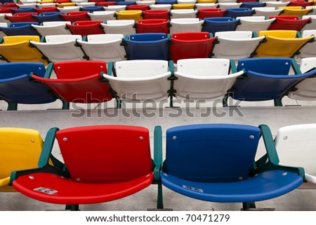 Rows of colored seats at an outdoor venue