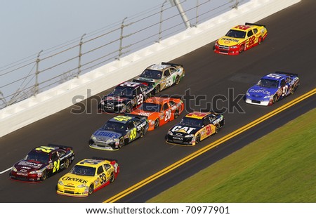 DAYTONA BEACH, FL - FEB 11:  The NASCAR Sprint Cup teams bring their race cars through turn 4 at the Daytona International Speedway on Feb 11, 2011 in Daytona Beach, FL