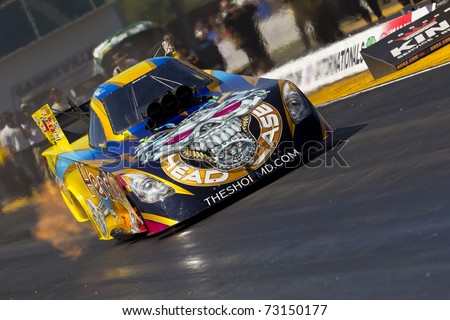 GAINESVILLE, FL - MAR 11:  Driver, Jim Head, brings his Funny Car race car down the track during a qualifying run for the Tire Kingdom NHRA Gatornationals race in Gainesville, FL on Mar 11, 2011