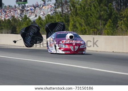 GAINESVILLE, FL - MAR 12: Driver, Greg Anderson, slows his Pro Stock race car during the Tire Kingdom NHRA Gatornationals race at the Gainesville Speedway in Gainesville, FL on Mar 12, 2011