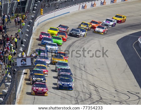 DOVER, DE - MAY 15:  The NASCAR Sprint Cup Series teams take for the FedEx 400 benefiting Autism Speaks race at the Dover International Speedway in Dover, DE on May 15, 2011.