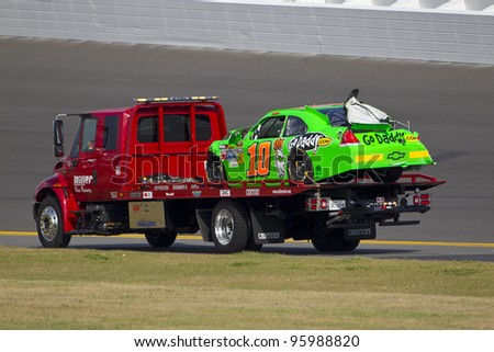 DAYTONA BEACH, FL - FEB. 23: Danica Patrick (10) spins off of turn 2 and wrecks during the Gatorade Duel 1 race at the Daytona International Speedway in Daytona Beach, FL on Feb 23, 2012. Her car is towed off the track.