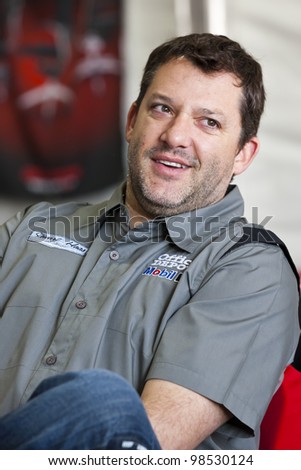 FONTANA, CA - MARCH 25:  Tony Stewart (14) takes time out to talk to guests of Office Depot during the Auto Club 400 at the Auto Club Speedway in Fontana, CA on March 25, 2012.