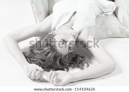 Beautiful young woman laying on the floor