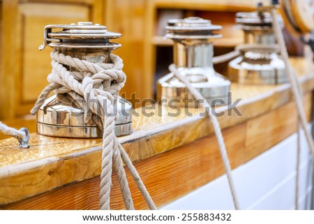 Closeup of winches with lines on a large sailing boat