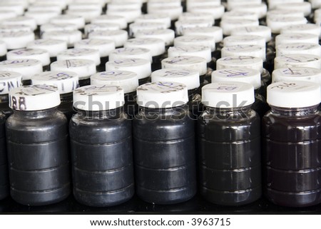 Rows of used oil samples on a bench in analytical laboratory