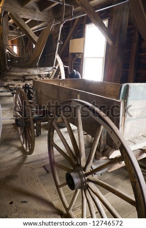 Antique horse-drawn wagon stored in a barn
