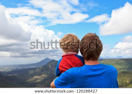 Family looking at mountains of Mauritius