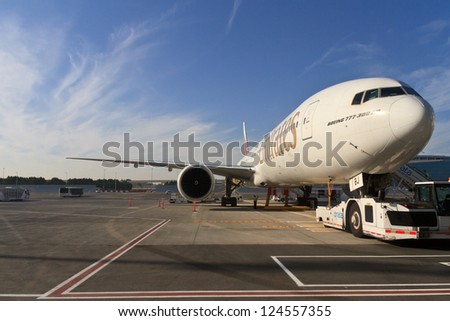 DUBAI, UAE - DECEMBER 26: Emirates Boeing 777 at Dubai Airport on December 26, 2012 in Dubai, UAE. Emirates is rated as a top 10 best airline in the world flying on youngest fleet.