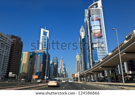 DUBAI - JANUARY 6: General view on trunk road and skyscrapers on January 6, 2013 in Dubai, UAE. Dubai is the most fast-growing city on the Earth.