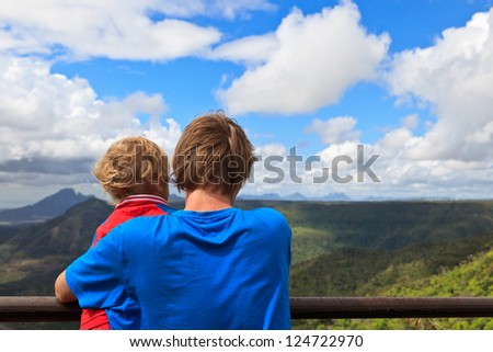 family looking at mountains of Mauritius