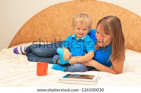 Family with touch pad at home