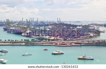 SINGAPORE - DECEMBER 28: Singapore industrial port on December 28, 2012 in Singapore. It\'s world\'s busiest port in terms of total shipping tonnage, transfers fifth of the world shipping containers.