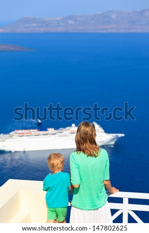 family looking at Santorini, Greece