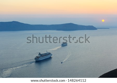 Sunset with cruise liners in Santorini island