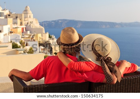 Happy Young Couple On Vacation In Santorini, Greece