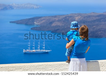 family looking at Santorini, Greece