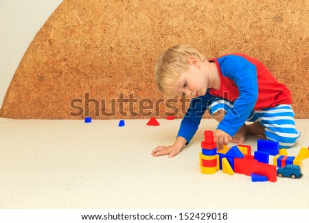 little boy playing with toys, learning and daycare concept