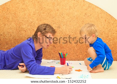 father and son drawing together