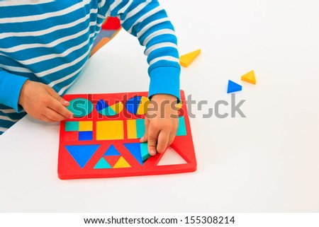 little boy learning shapes, early education and daycare concept