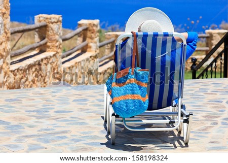 woman on sea vacation by the pool
