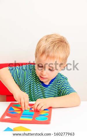 little boy learning shapes, early education and daycare concept