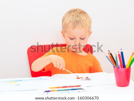 little boy drawing, early education concept