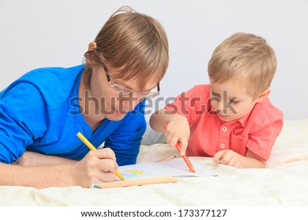 father and son drawing together, early learning