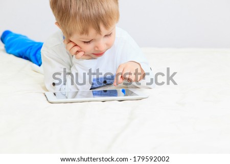 little boy with digital tablet, early learning