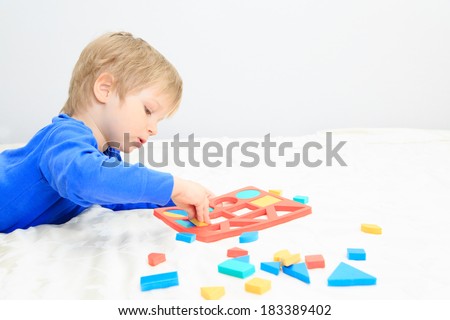 little boy learning shapes, early education