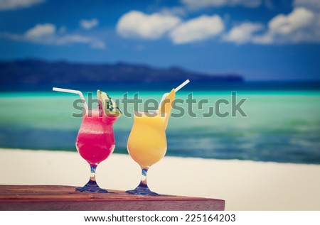 mango and watermelon cocktails on tropical beach