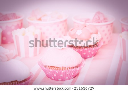 dessert table in pink at girls birthday party