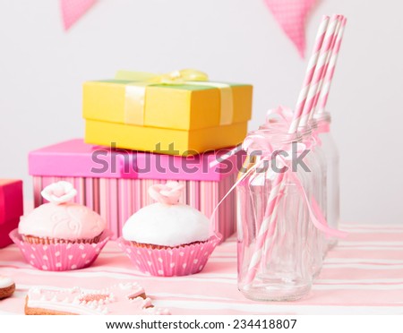 dessert table and presents at girls pink party