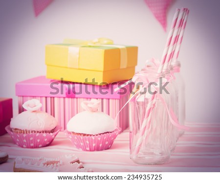 dessert table and presents at girls pink party