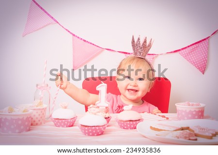 cute little princess at first birthday party