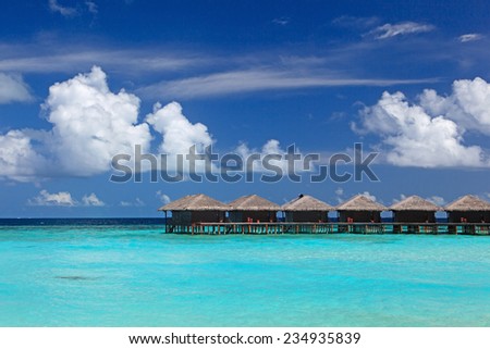 water villas in tropical sea resort