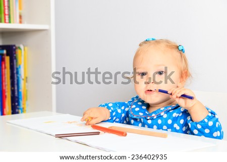 little girl with pencils, early learning